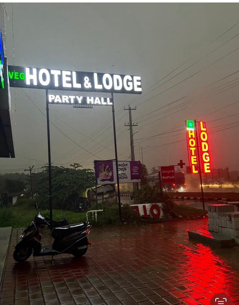 Hotel Radha signage at night